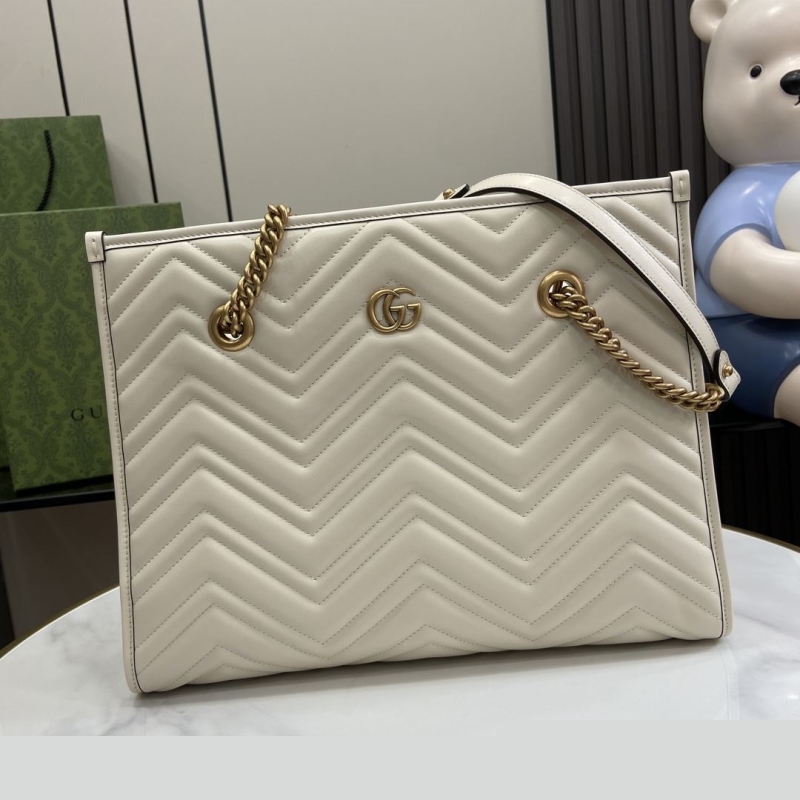 G*u*i shopping bags